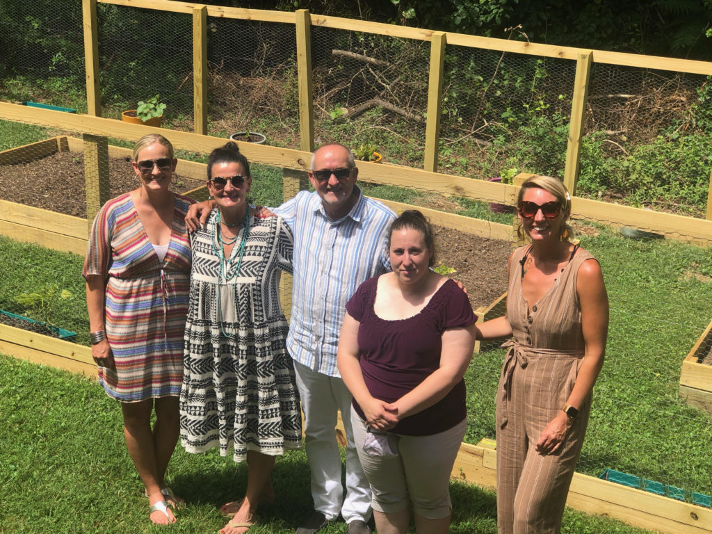 IHOH board members w/ Opening new doors foundation executive director, Talia outside Marijke's place. They put in a garden so the woman can have an additional space for growth & healing. 